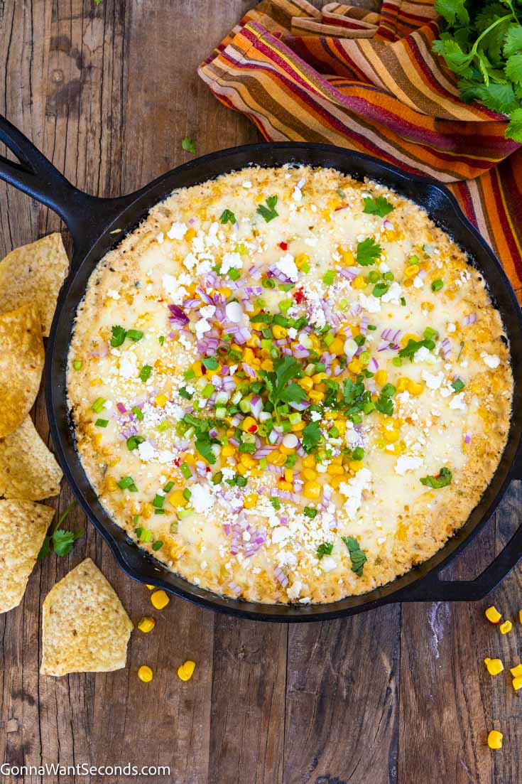 mexican street corn dip in a cast iron skillet