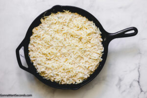 how to make mexican corn dip with cream cheese , spoon mixture to prepared pan and top with cheese