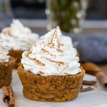 Impossible Pumpkin Pie Cupcakes with whipped cream on top
