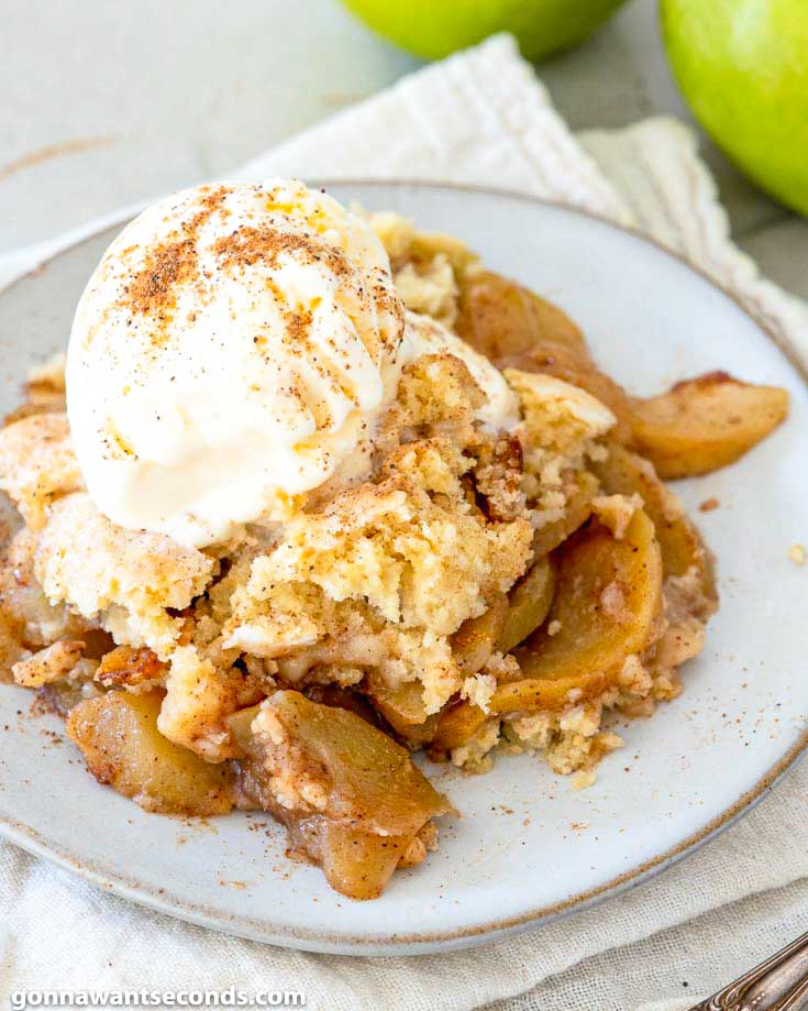 This old fashion apple cobbler is filled with tender, juicy apples and topped with a to-die-for, fluffy cake-like topping. It's the perfect fall dessert. #applerecipes #cobblerrecipes