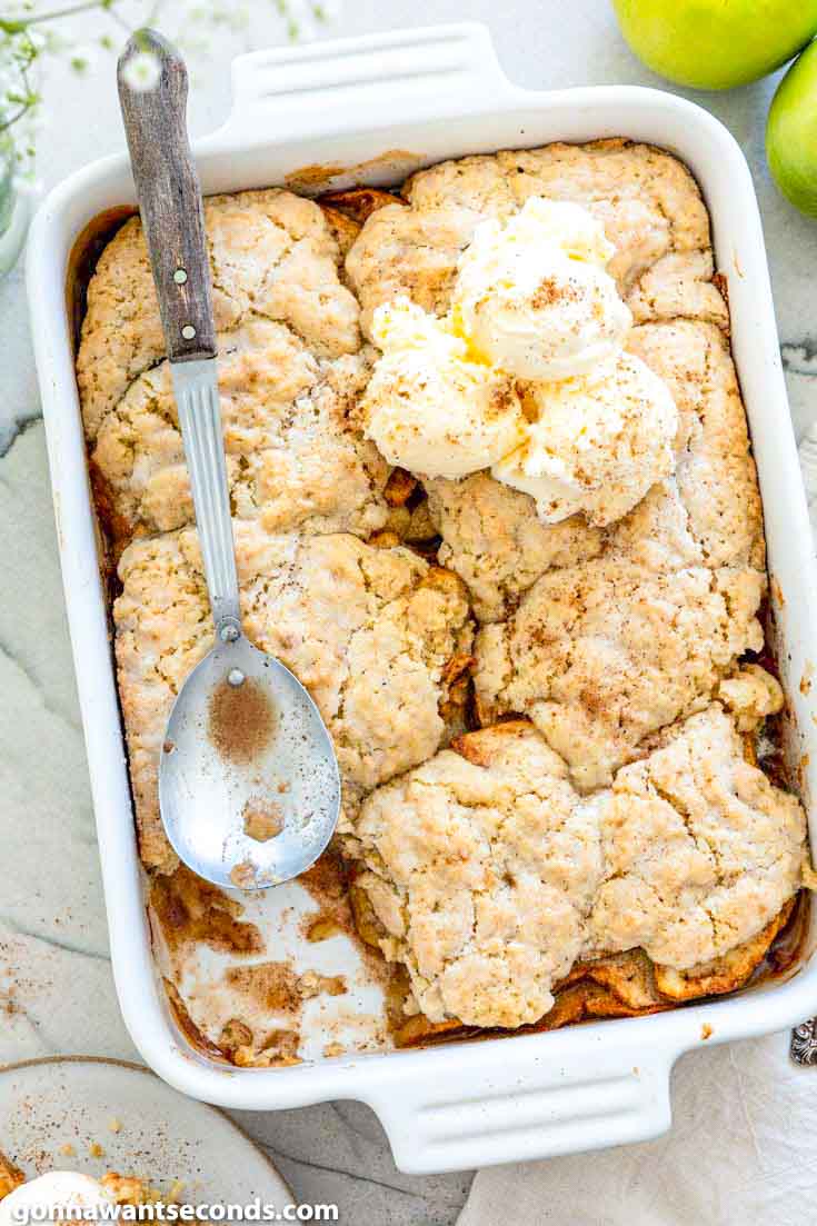 This old fashion apple cobbler is filled with tender, juicy apples and topped with a to-die-for, fluffy cake-like topping. It's the perfect fall dessert. #applerecipes #cobblerrecipes