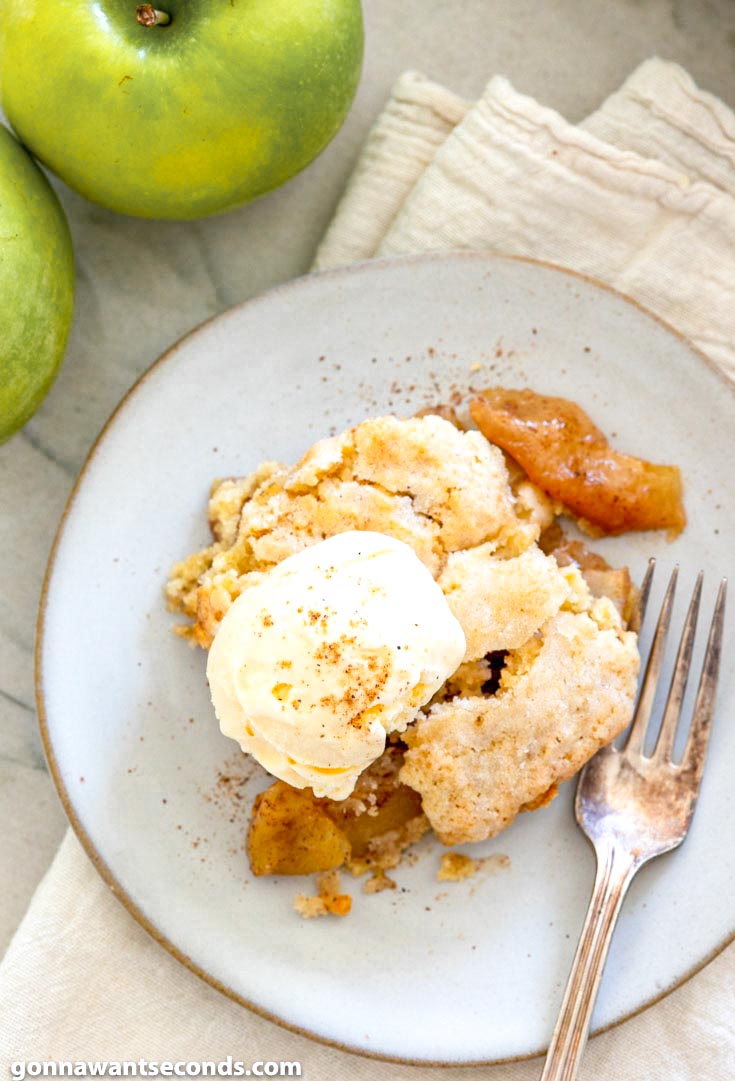 This old fashion apple cobbler is filled with tender, juicy apples and topped with a to-die-for, fluffy cake-like topping. It's the perfect fall dessert. #applerecipes #cobblerrecipes