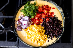how to make cowboy queso velveeta , add the rest of the ingredients
