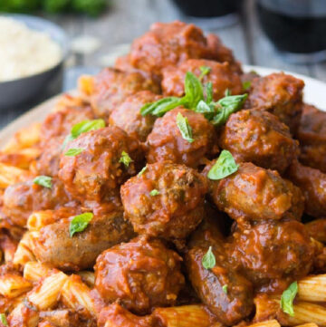 A plateful of pasta topped with Italian Sunday Gravy and meatballs