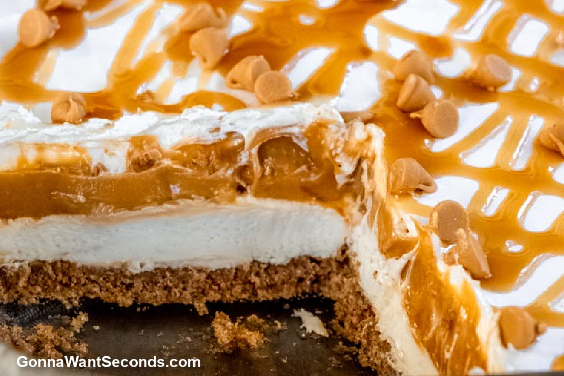 A whole butterscotch yum yum recipe , slice taken out showing the layers inside