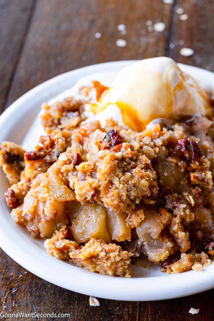 Always a classic, Apple Crisp is sure to be a crowd-pleaser with sweet apple filling balancing a generous crisp top that just begs for a scoop of ice cream! #applecrisp #appledesserts