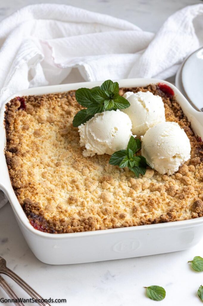 cherry cobbler with cake mix and pie filling topped with vanilla ice cream