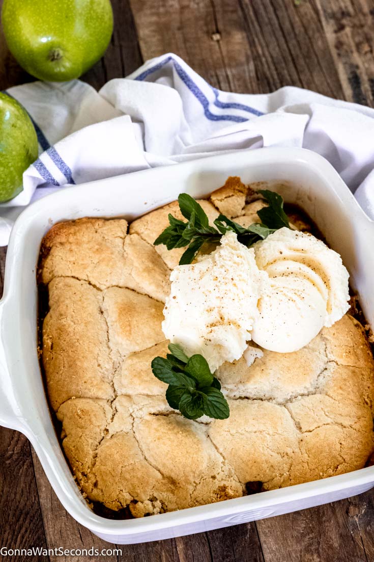 bisquick apple cobbler with fresh apples in a baking dish