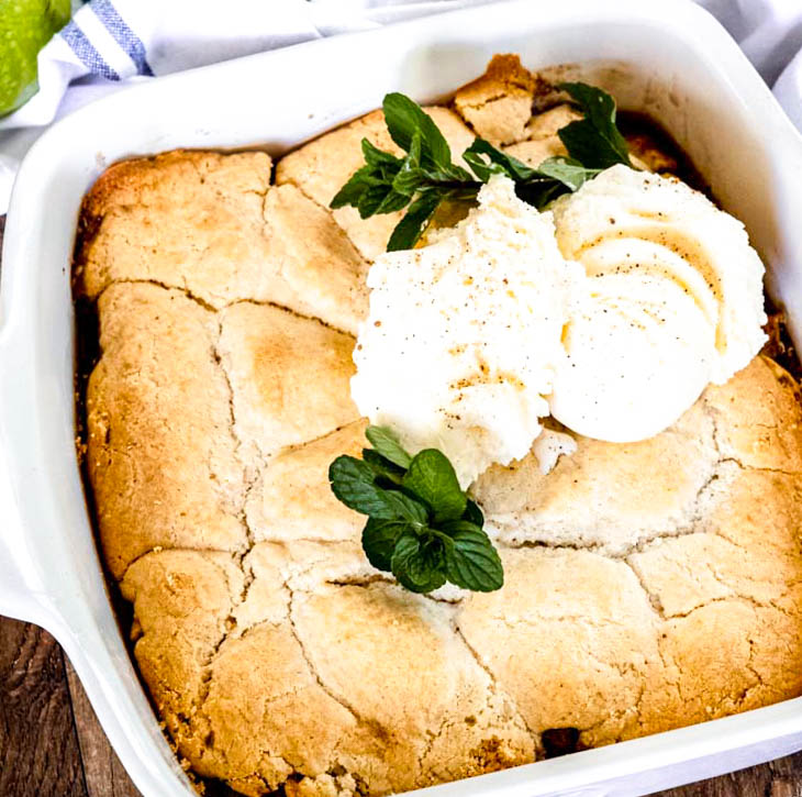 This Bisquick apple cobbler is a delicious, old-fashioned cobbler made easier with Bisquick! It's loaded with fresh, tender, juicy, and warm spiced apples! #bisquickcobbler #applecobbler bisquick apple cobbler with fresh apples in a baking dish
