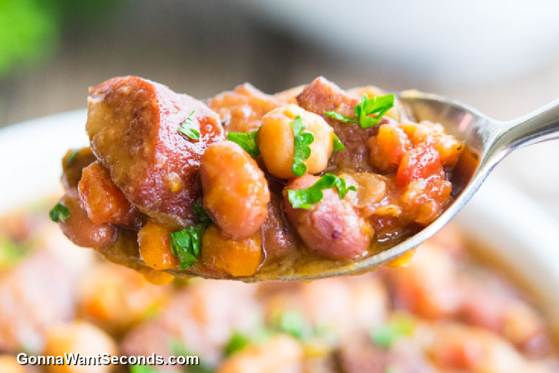 scooping sausage and bean soup