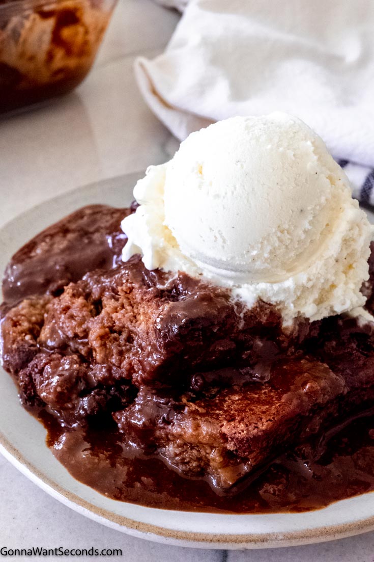 chocolate cobbler topped with a scoop of vanilla ice cream