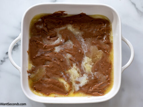 how to make southern chocolate cobbler, Spoon the batter over the melted butter.