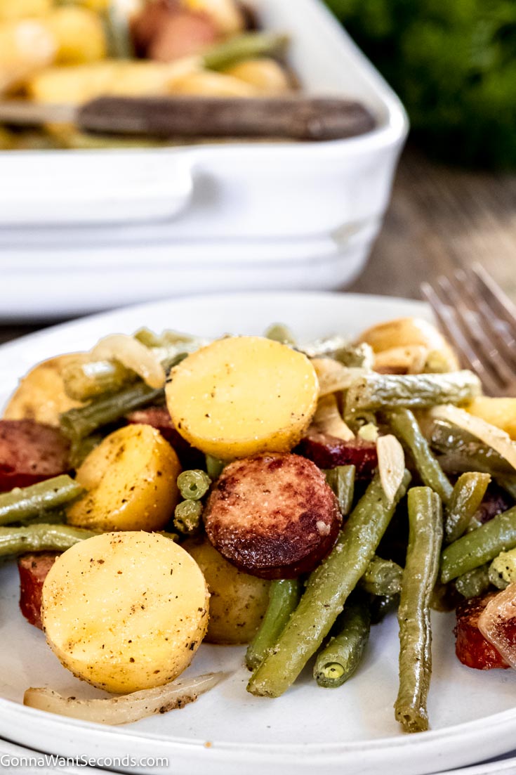 sausage potatoes and green beans , on a plate