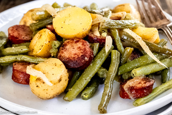 smoked sausage green beans and potatoes , on a plate