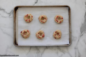 Step 8 how to make strawberry cheesecake cookies, Create an indentation in the top half of the dough ball.