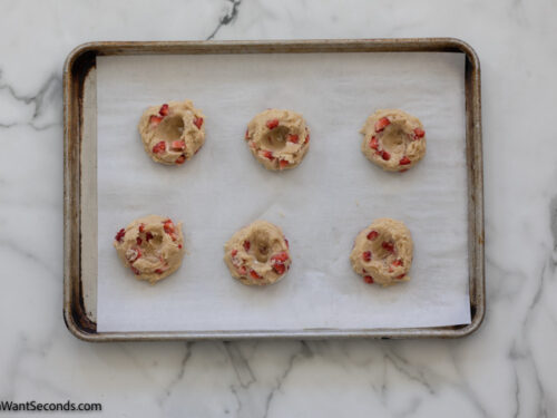 Step 8 how to make strawberry cheesecake cookies, Create an indentation in the top half of the dough ball.