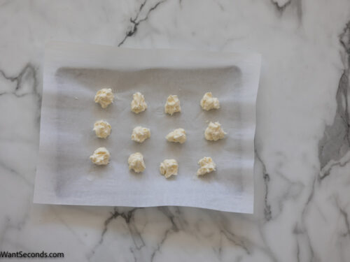 Step 2 how to make strawberry cheesecake cookies, Use a cookie scoop to portion out 12 equal portions of the cream cheese mixture onto a parchment-lined small baking sheet. Freeze.