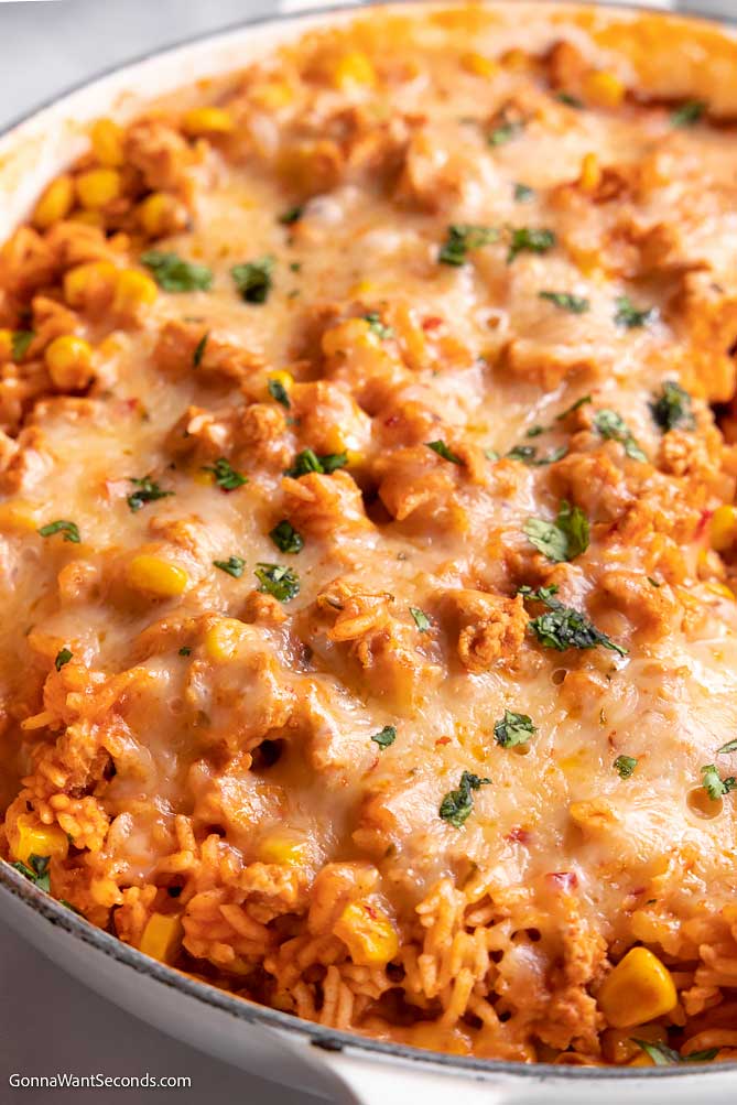 taco rice skillet topped with cheese