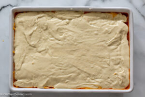 how to make bisquick impossible taco bake step 7, Pour over the beef mixture.