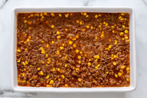how to make bisquick quick taco bake step 4, Transfer the beef mixture in the prepared baking pan.