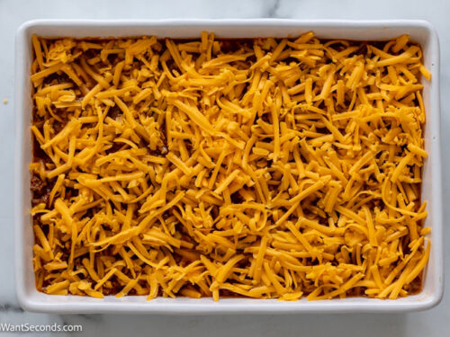 how to make bisquick taco bake step 5, Sprinkle cheese over the beef mixture.