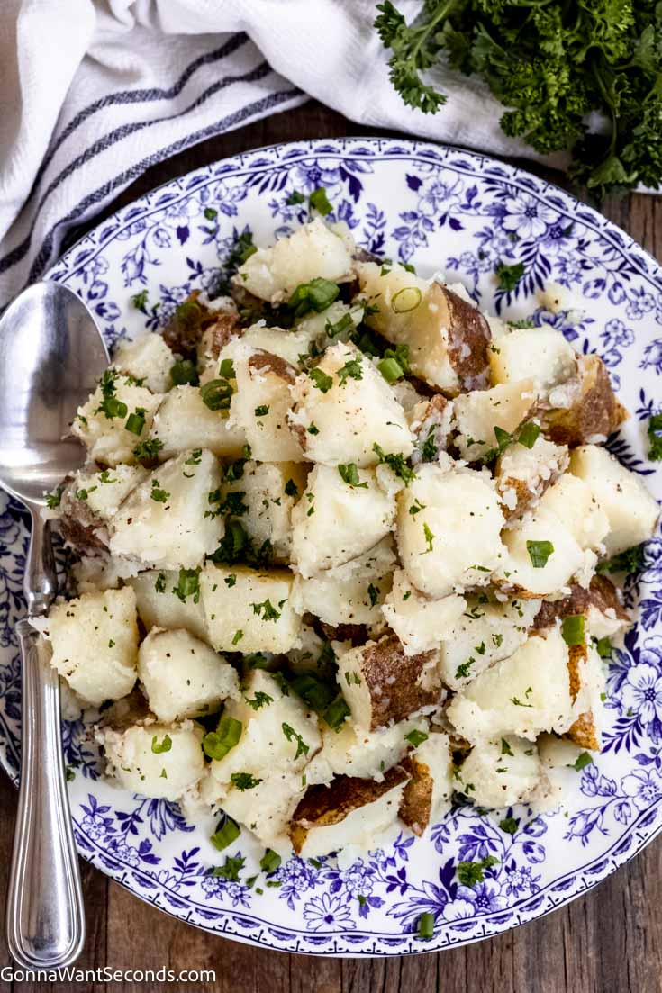 Buttered Potatoes on a plate top shot