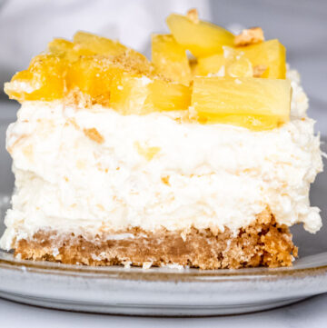 A slice of Pineapple delight with pineapple bits on top