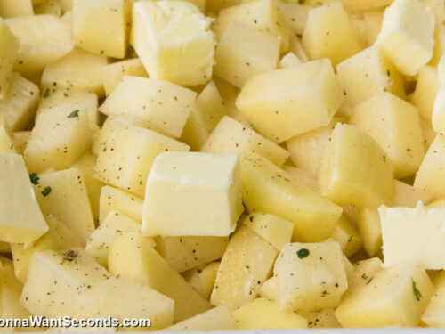 how to make creamy ranch potatoes step 2, evenly dot the top with butter