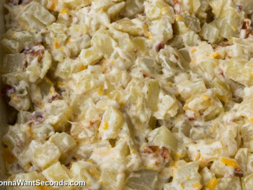 how to make hidden valley ranch potatoes with bacon step 3, Bake, then mix. Add half of the cheese and bacon.