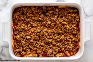 how to make taco lasagna, layer 1/3 of meat mixture