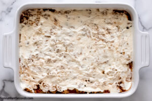 how to make taco lasagna with tortillas, layer 1/3 of the ricotta mixture