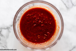 how to make simple taco lasagna recipe , stir together salsa and tomato sauce