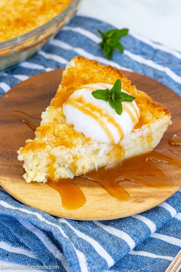 a slice of best impossible coconut pie recipe topped with vanilla ice cream