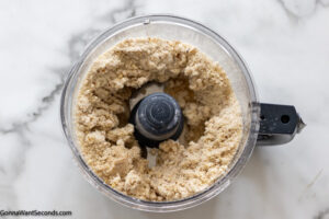 How to make lemon lush with shortbread crust step 2, Add the sugar and pecan and and process.