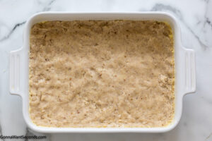 How to make lemon lush delight step 3, Press into baking pan. Bake.
