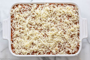 how to make tiktok million dollar spaghetti step 9, sprinkle top with mozzarella and bake
