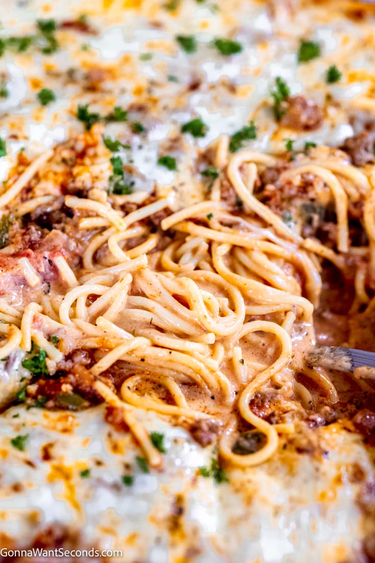 tiktok spaghetti with white and red sauce in a casserole dish