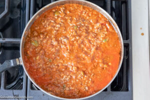 how to make tiktok million dollar spaghetti step 3, add seasonings and spaghetti sauce