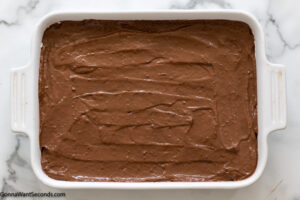 how to make oreo delight pudding recipe step 8, Spread over the cream cheese layer. Place in the fridge until firm.