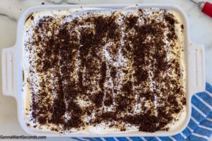 how to make oreo delight step 10, Sprinkle Oreo crumbs.