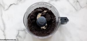 how to make oreo delight step 1, Crush Oreos in the food processor.