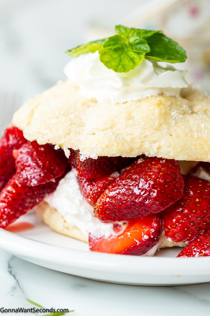 Bisquick strawberry shortcake biscuits topped with whipped cream and fresh strawberries