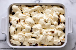 how to make blueberry angel food dessert step 5, Spread the mixture evenly over the cake and cool whip.
