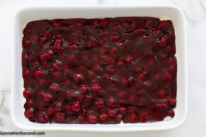 how to make cherry dump cake step 1 , spread cherry pie filling