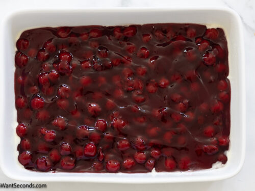 how to make cherry dump cake step 1 , spread cherry pie filling