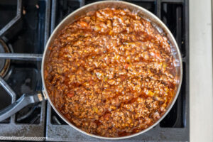 Step 2 how to make the best mexican beef casserole ever, Stir in taco seasoning and salsa.