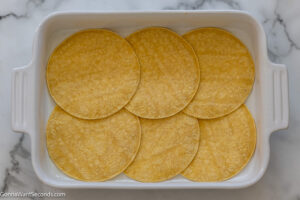 Step 4 how to make easy mexican casserole with ground beef, Arrange 6 tortillas in the bottom of the dish