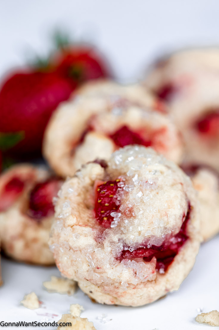 a pile of strawberry cookies with real strawberries