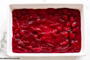 step 1 how to make strawberry dump cake , spread the pie filling on the baking dish