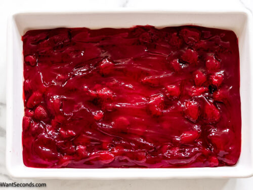 step 1 how to make strawberry dump cake , spread the pie filling on the baking dish